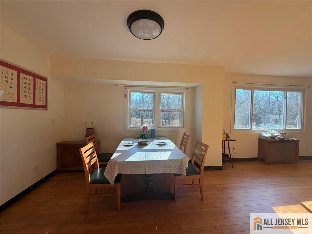57 North Disbrow Hill Road Monroe Township, NJ 08831 - Photo 5 of 24 a view of a dining room with furniture window and wooden floor