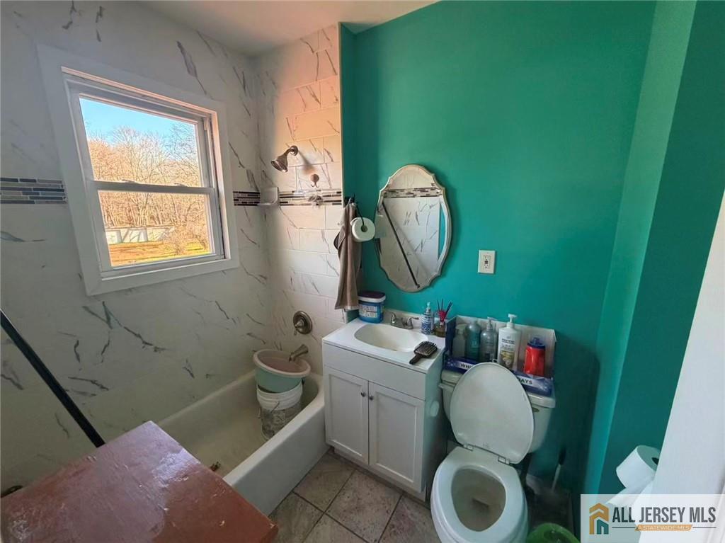 57 North Disbrow Hill Road Monroe Township, NJ 08831 - Photo 8 of 24 a bathroom with a toilet mirror vanity and a window