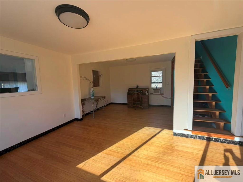 57 North Disbrow Hill Road Monroe Township, NJ 08831 - Photo 10 of 24 a bedroom with a bed and wooden floor