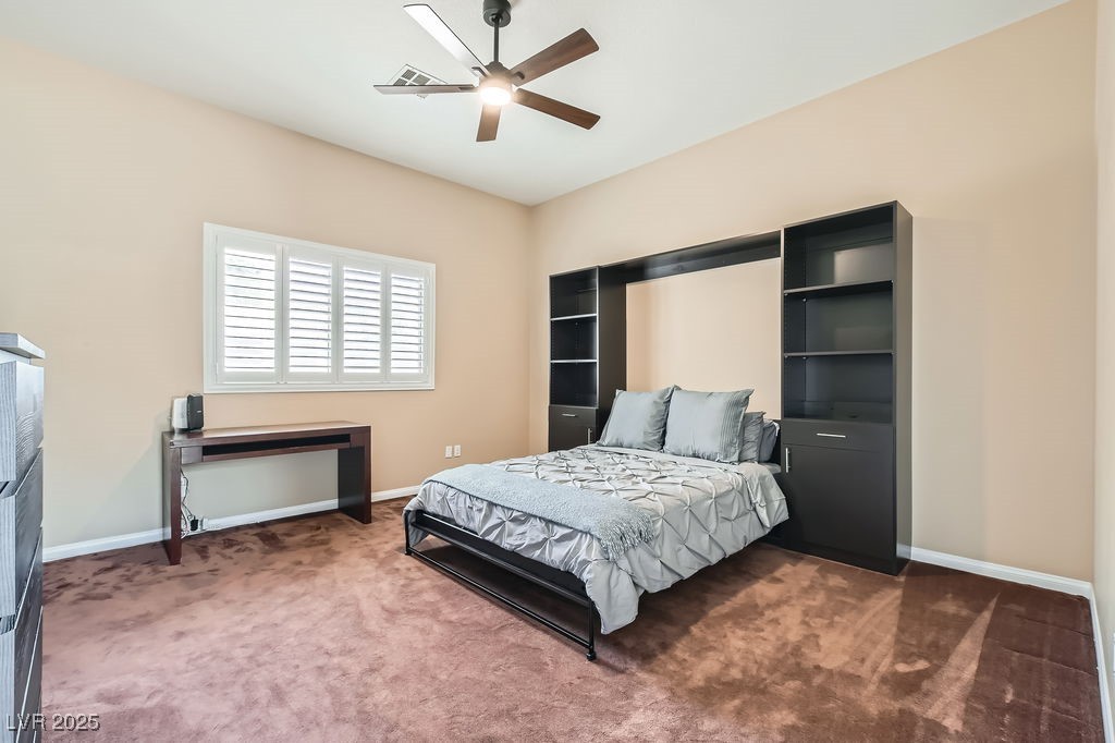 647 Foxhall Road Henderson, NV 89002 - Photo 31 of 82 Carpeted bedroom featuring baseboards and a ceiling fan