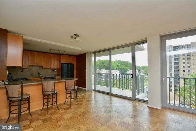 a view of kitchen with furniture and large window