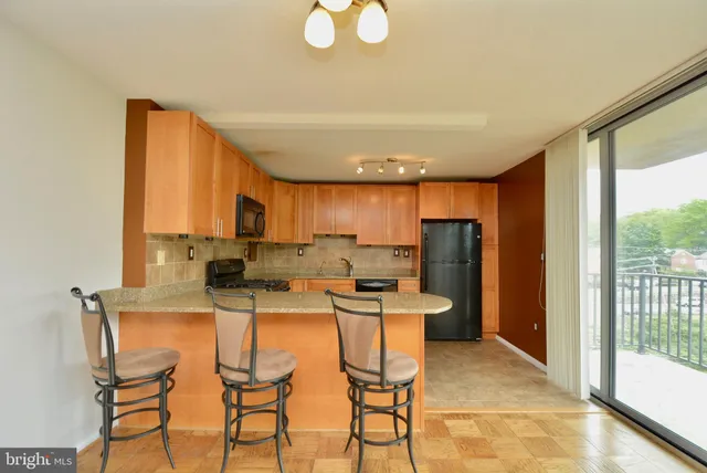 a kitchen with a table and chairs in it