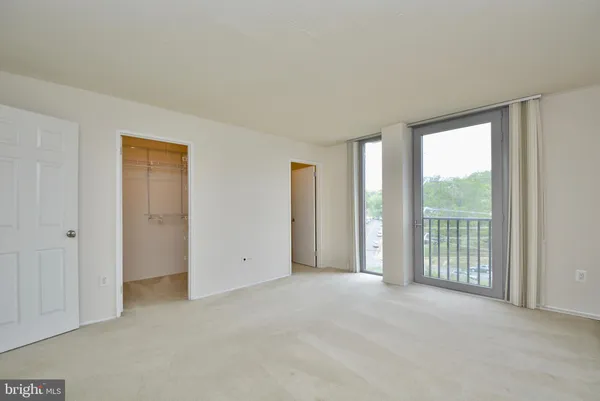 a view of an empty room with a window