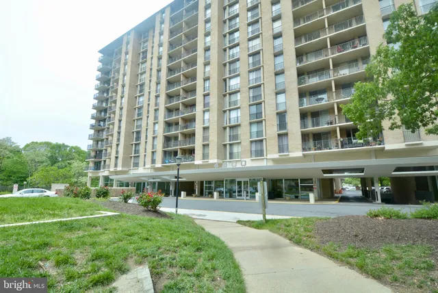 a front view of a building with a garden