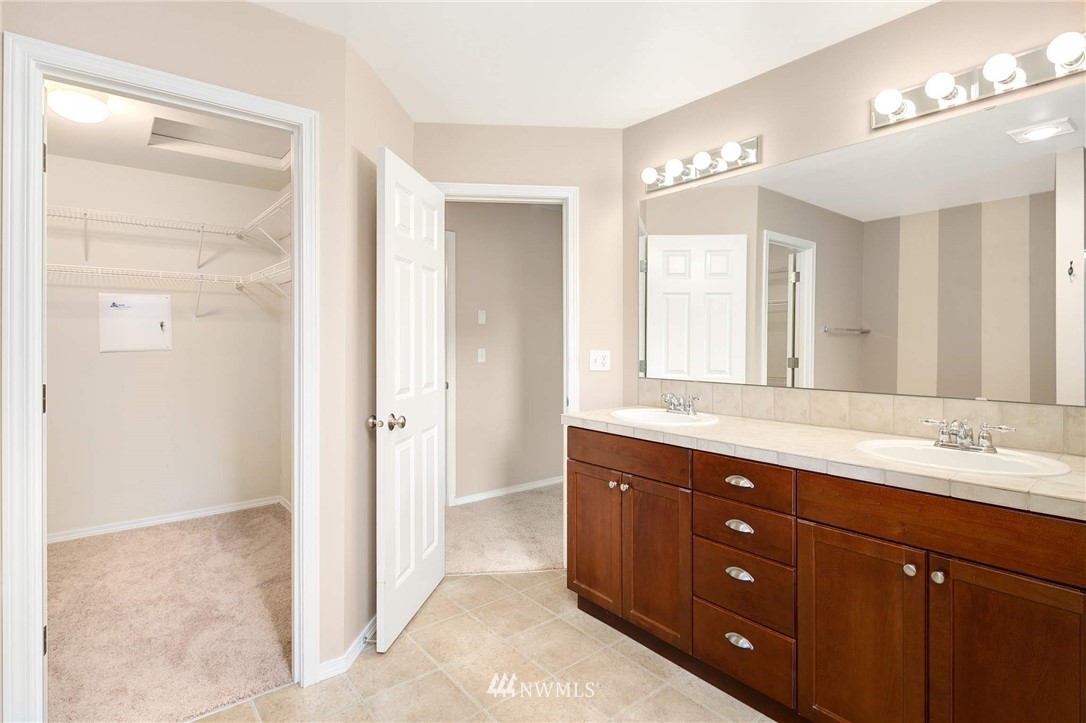 2522 Stafford Way Bothell, WA 98012 - Photo 12 of 23 a spacious bathroom with a granite countertop sink mirror and a