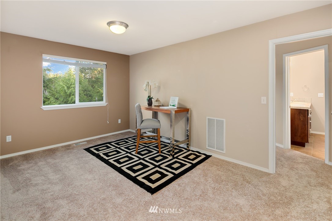 2522 Stafford Way Bothell, WA 98012 - Photo 14 of 23 a living room with a rug and a window