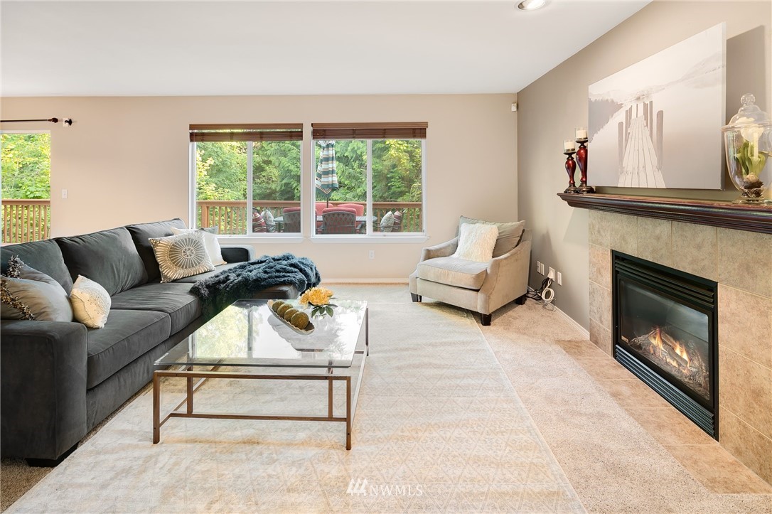 2522 Stafford Way Bothell, WA 98012 - Photo 9 of 23 a living room with furniture and a fireplace