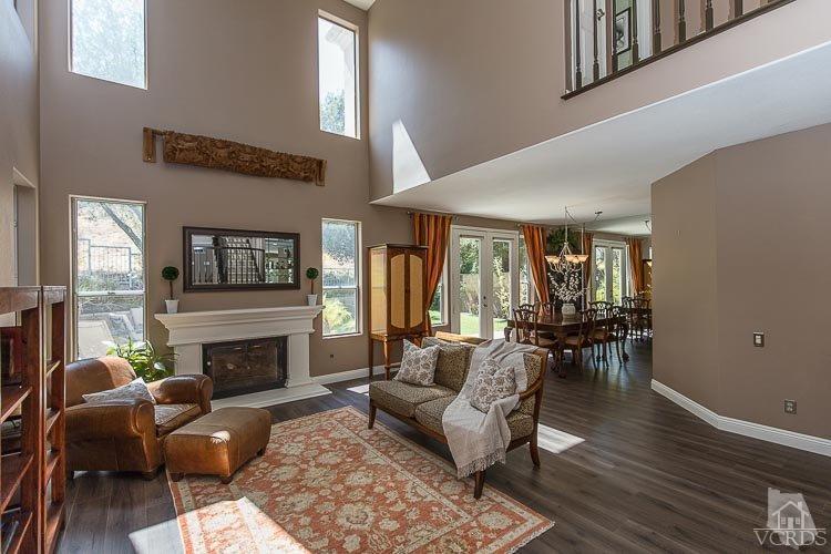 3865 Timberridge Road Moorpark, CA 93021 - Photo 22 of 51 a living room with furniture dining table and a fireplace