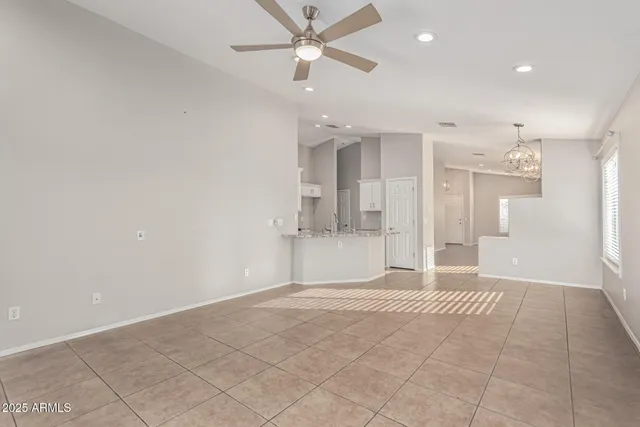 a view of a kitchen with a sink and a refrigerator