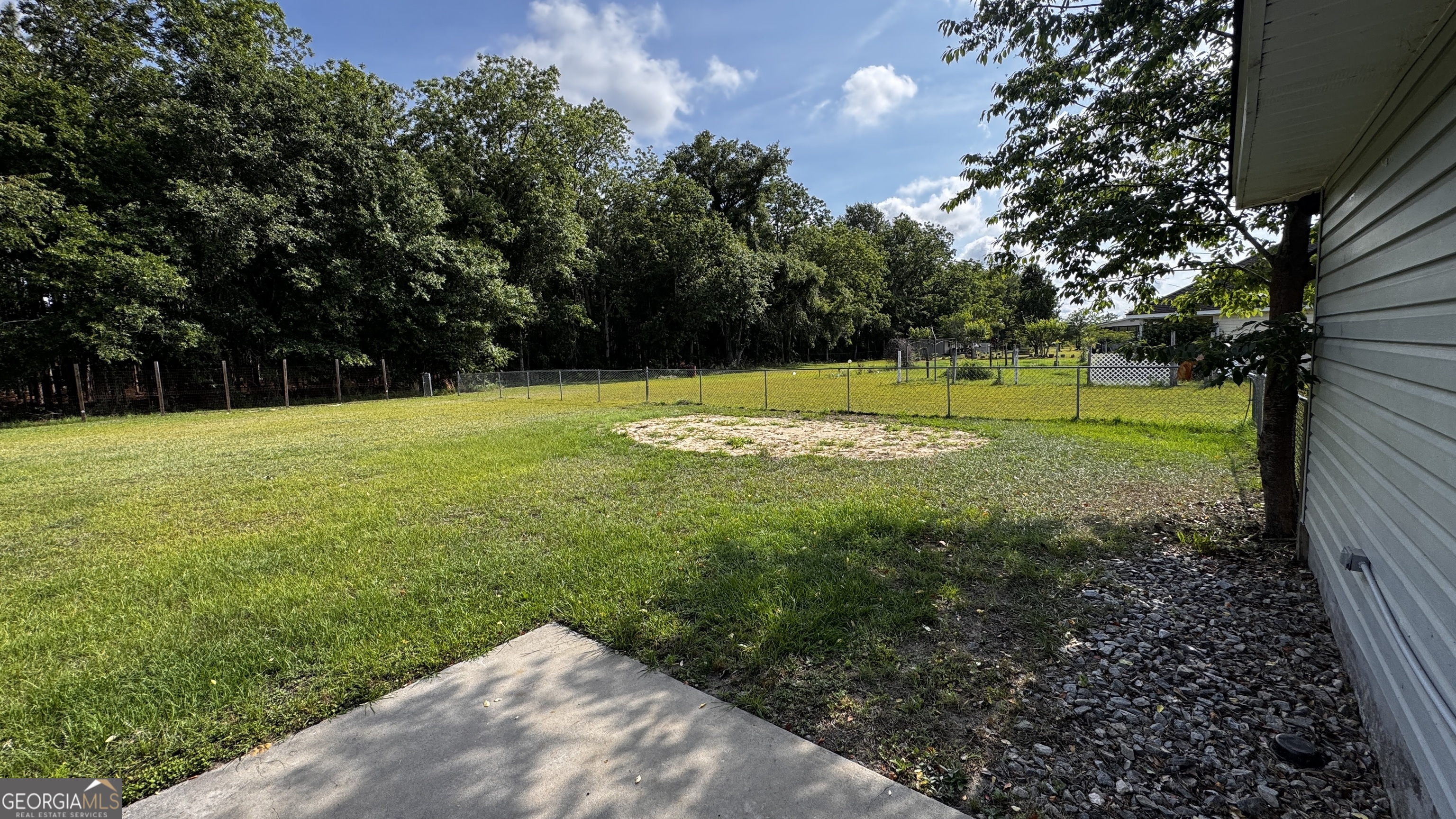 512 Antietum Road Collins, GA 30421 - Photo 15 of 16 a view of a golf course with a lake