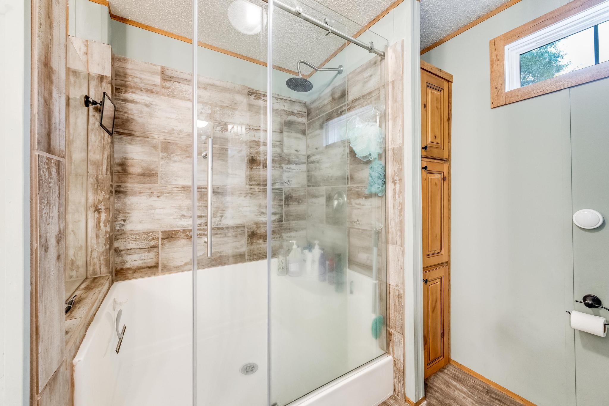 6224 Old River Road Baker, FL 32531 - Photo 17 of 35 a bathroom with a shower