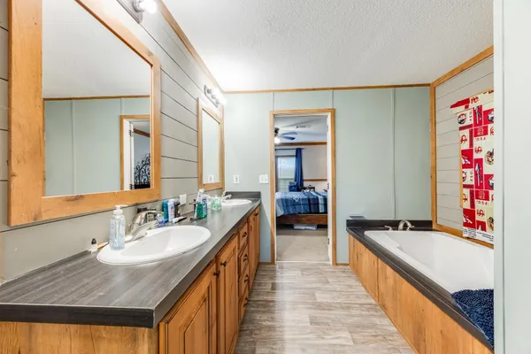 a spacious bathroom with a sink double vanity
