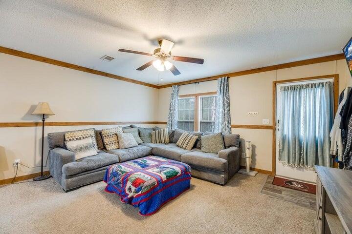 6224 Old River Road Baker, FL 32531 - Photo 3 of 35 a living room with furniture and a large window