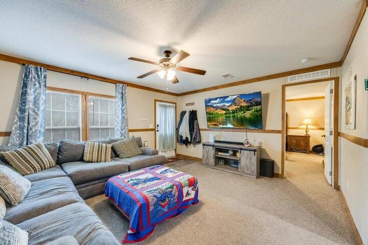 6224 Old River Road Baker, FL 32531 - Photo 4 of 35 a living room with furniture and a flat screen tv