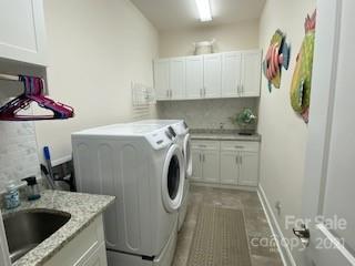 7008 Fallondale Road Waxhaw, NC 28173 - Photo 8 of 29 a utility room with sink dryer and washer