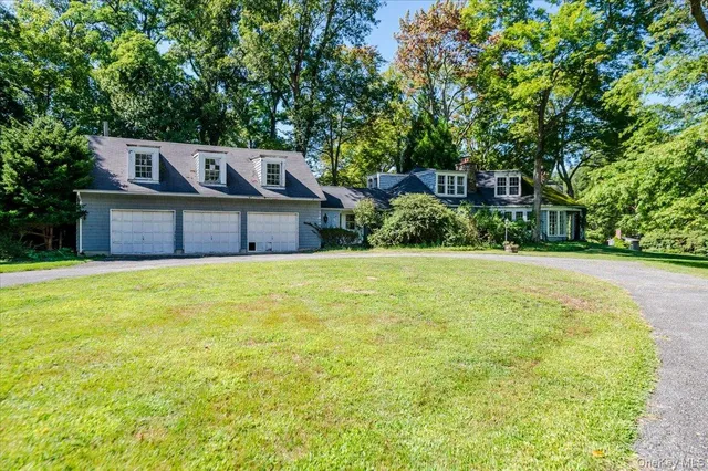 a front view of a house with yard
