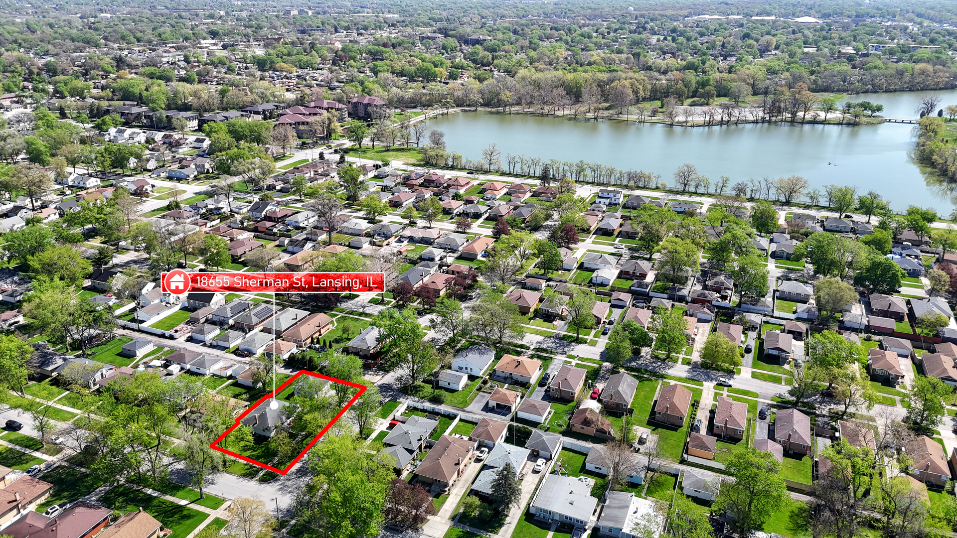 18655 Sherman Street Lansing, IL 60438 - Photo 4 of 21 an aerial view of residential houses with outdoor space and lake view