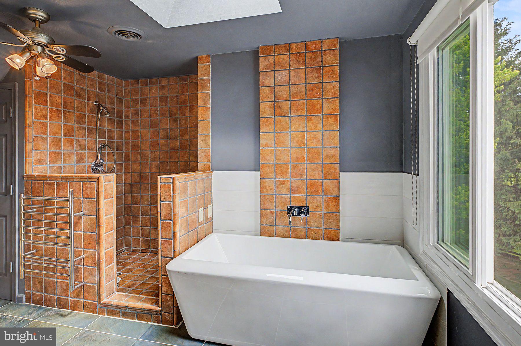 4009 Smoke Road Doylestown, PA 18902 - Photo 35 of 52 a bathroom with a bathtub and shower