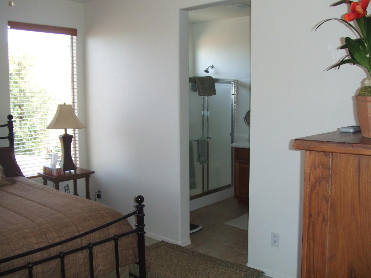 4606 East Rakestraw Lane Gilbert, AZ 85298 - Photo 8 of 19 master bed/ looking into master bath