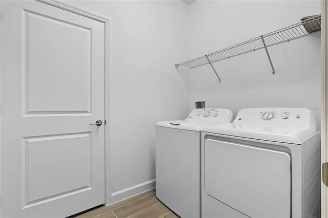 a white toilet sitting next to a shower