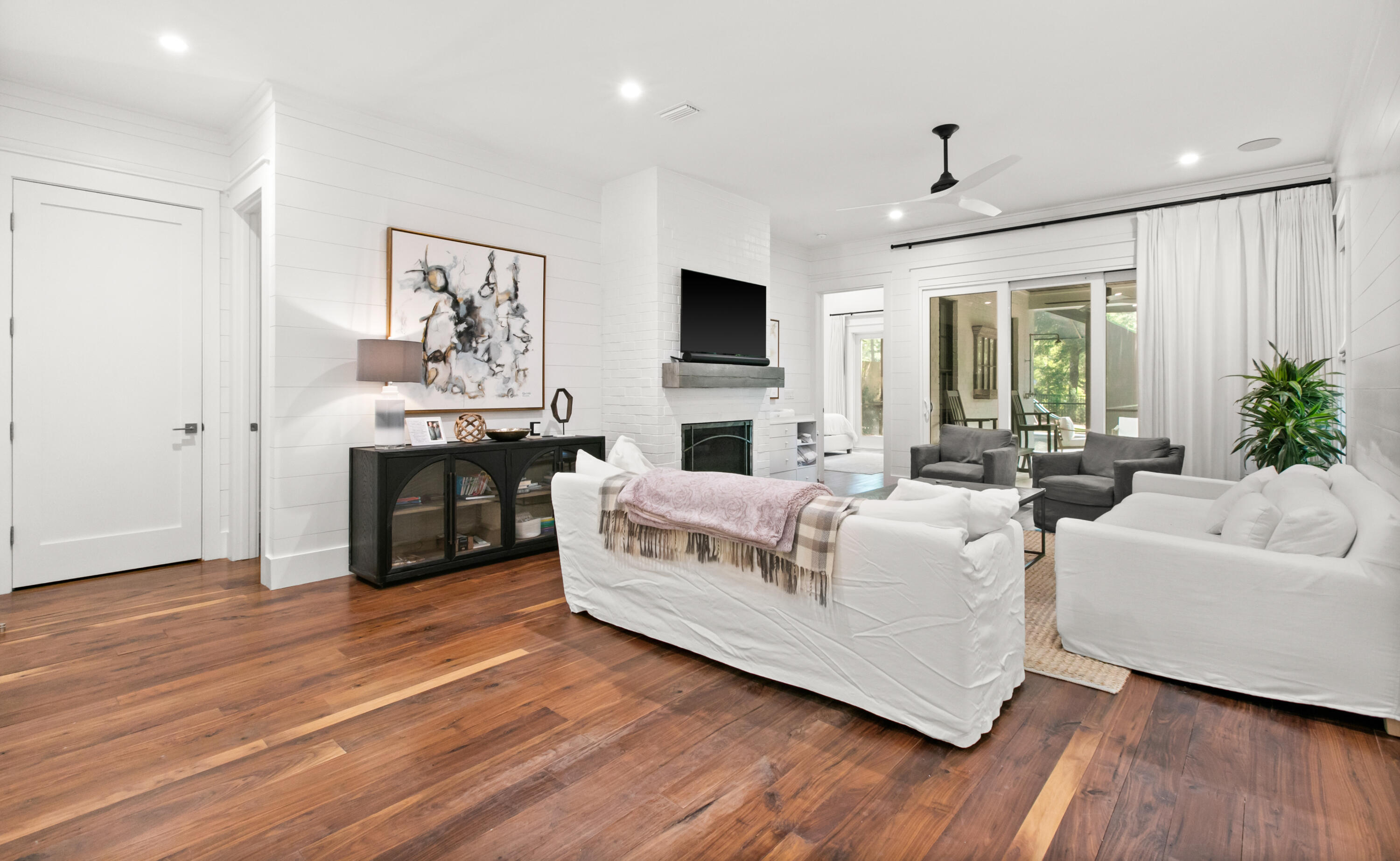 380 Ricker Avenue Santa Rosa Beach, FL 32459 - Photo 15 of 55 a living room with furniture fireplace and flat screen tv
