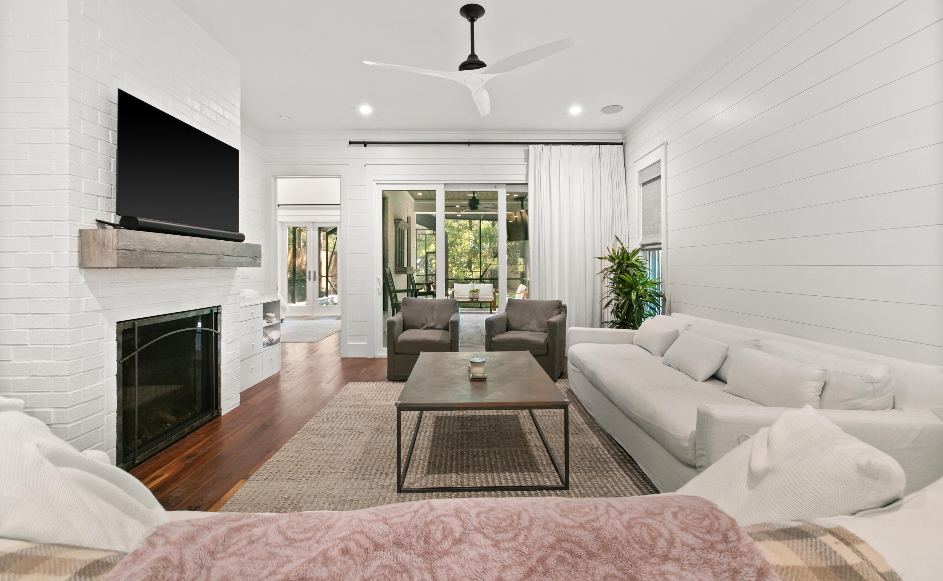 380 Ricker Avenue Santa Rosa Beach, FL 32459 - Photo 16 of 55 a living room with furniture a flat screen tv and a fireplace