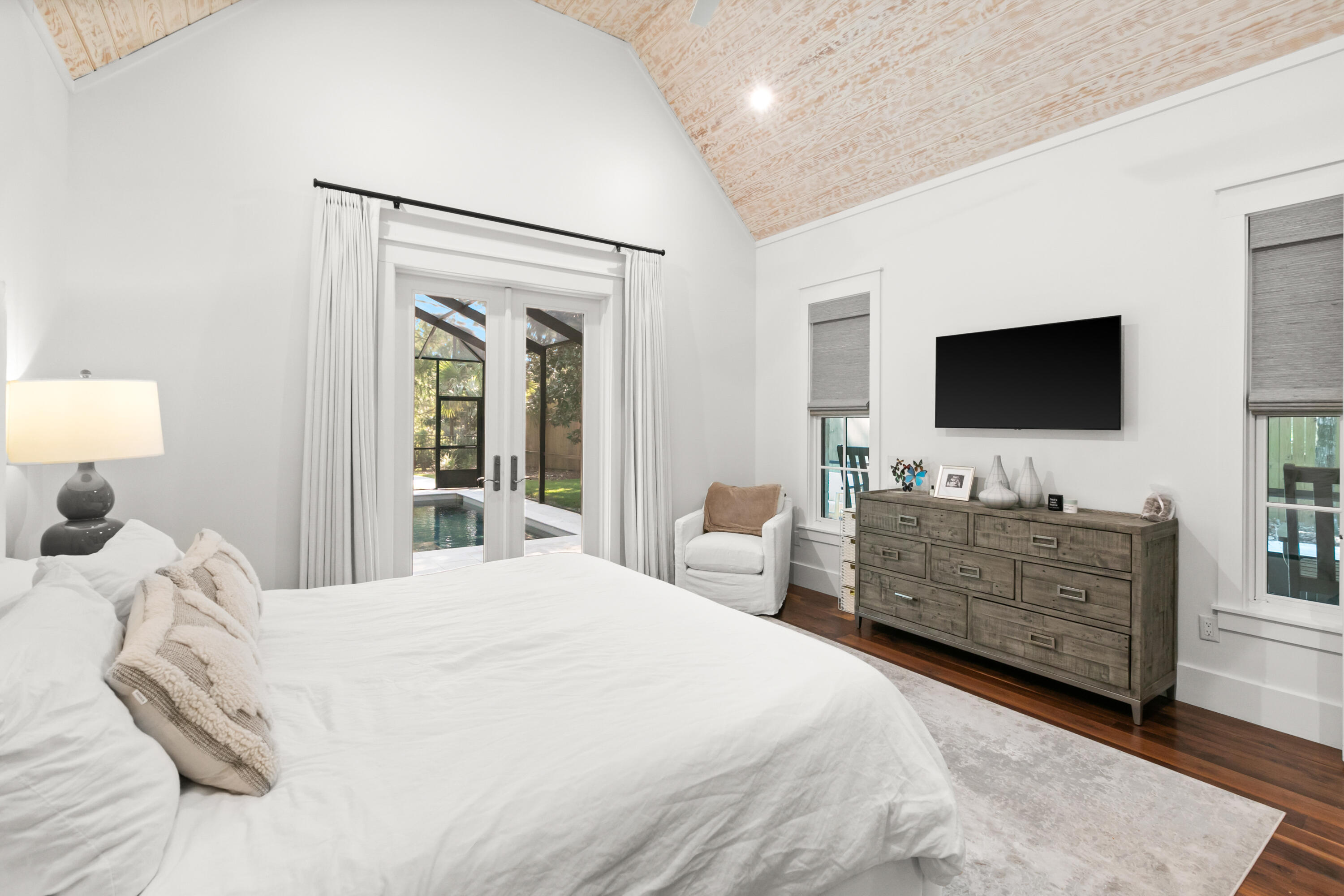 380 Ricker Avenue Santa Rosa Beach, FL 32459 - Photo 20 of 55 a bed room with a bed and a flat screen tv