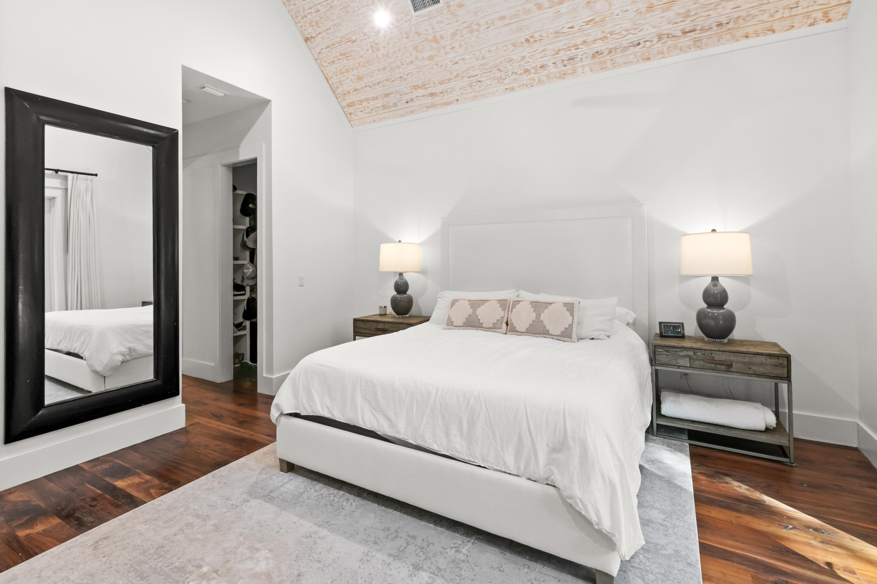 380 Ricker Avenue Santa Rosa Beach, FL 32459 - Photo 21 of 55 a bedroom with a bed and wooden floor