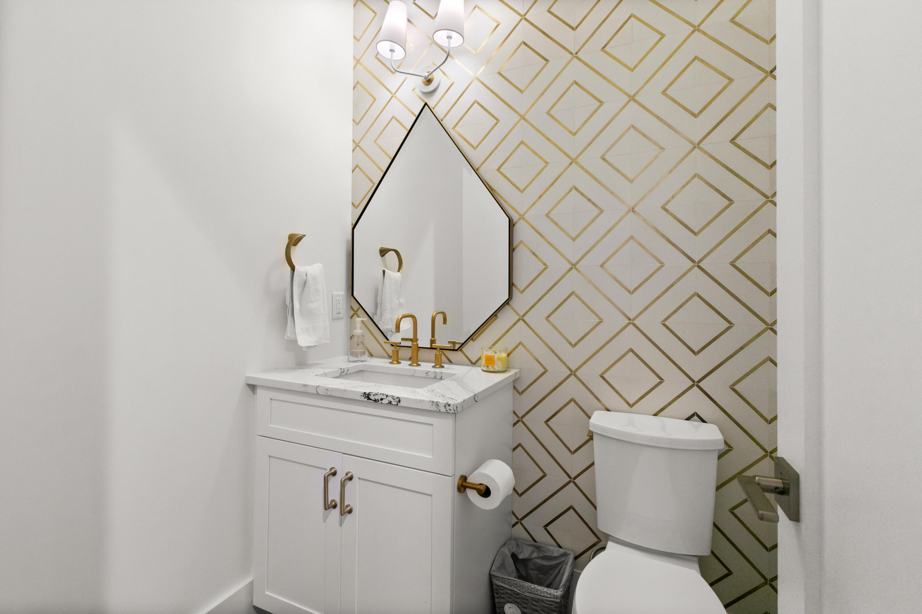 380 Ricker Avenue Santa Rosa Beach, FL 32459 - Photo 26 of 55 a bathroom with a sink mirror vanity and toilet