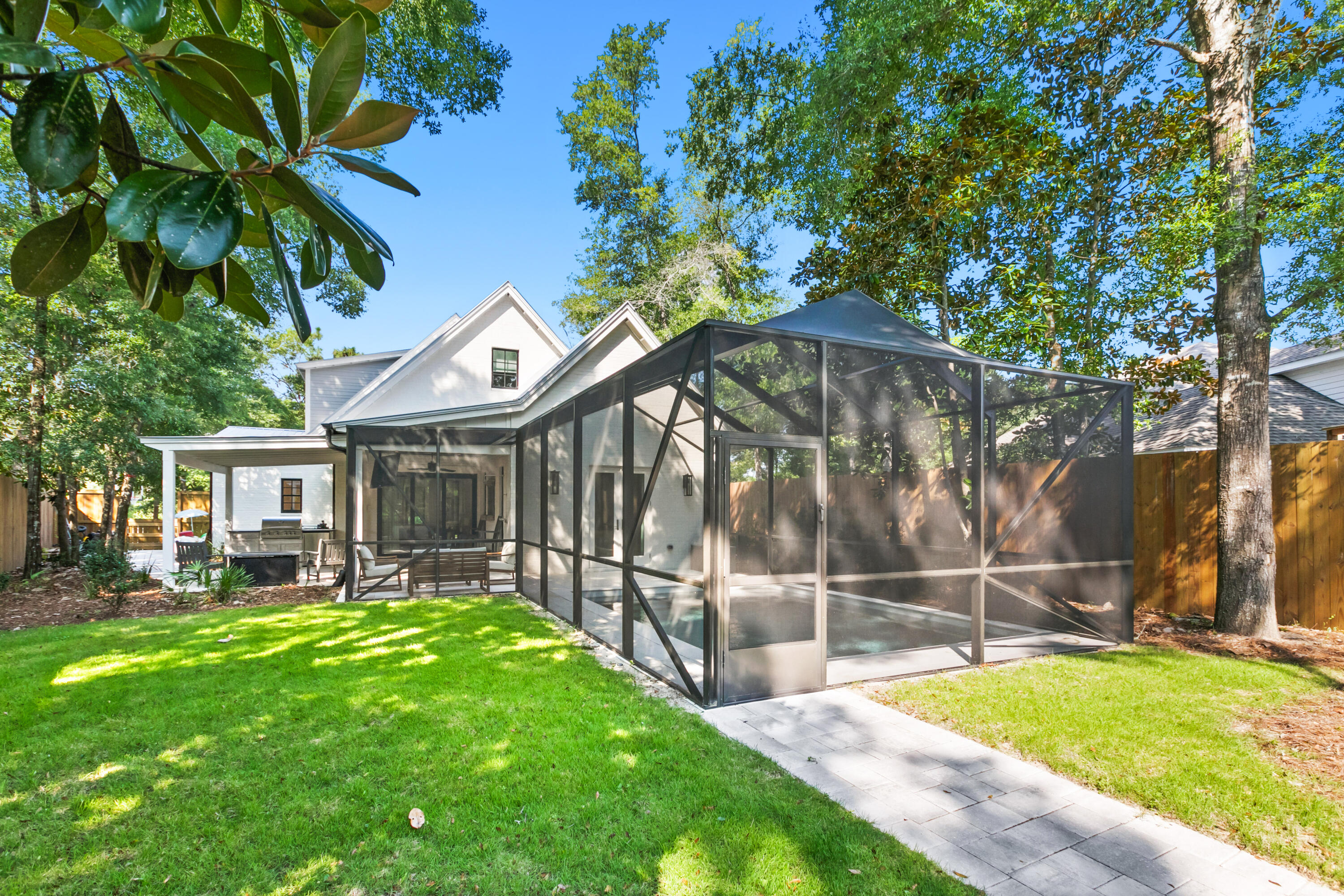 380 Ricker Avenue Santa Rosa Beach, FL 32459 - Photo 43 of 55 a view of a house with backyard and sitting area