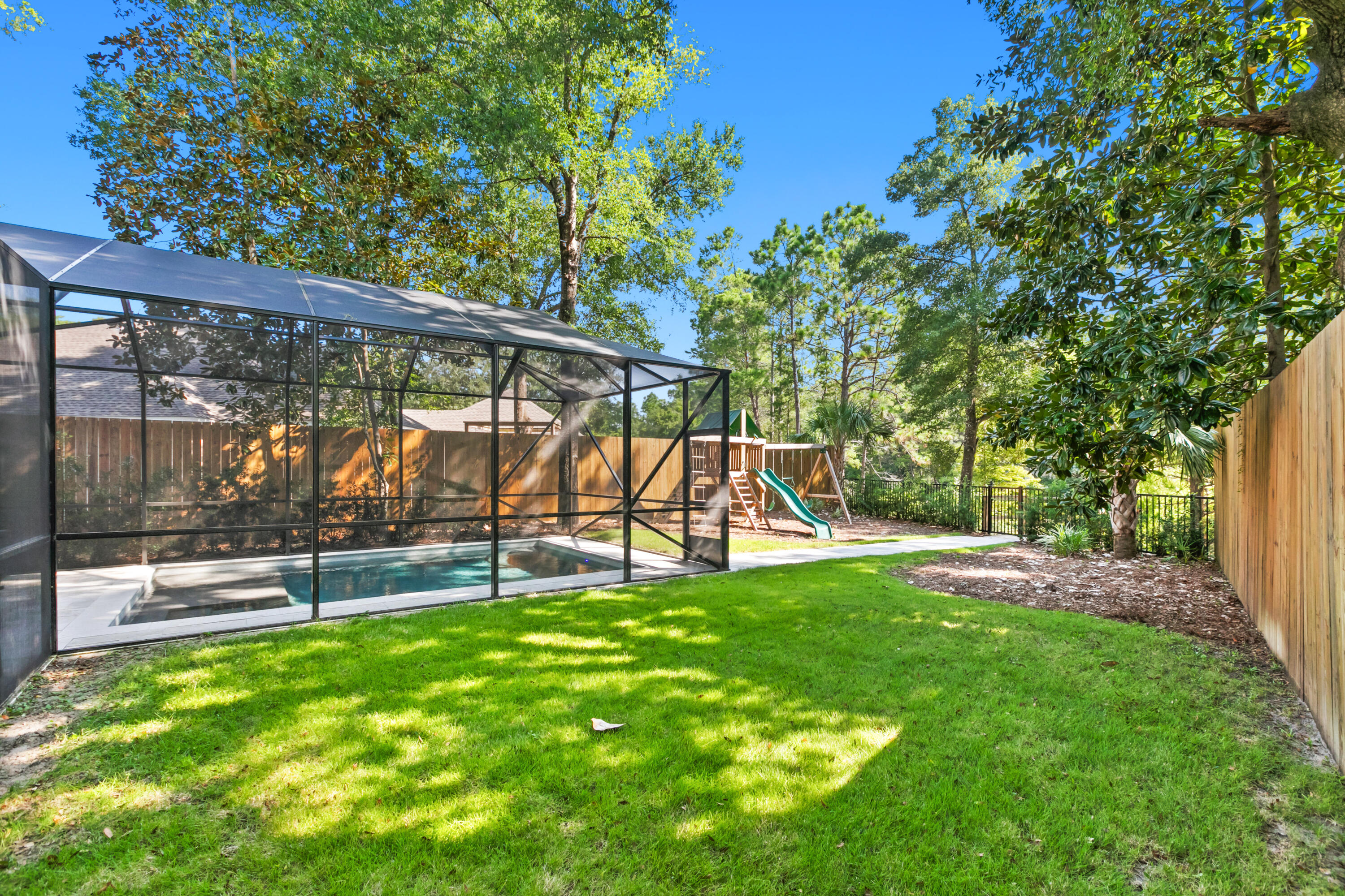 380 Ricker Avenue Santa Rosa Beach, FL 32459 - Photo 45 of 55 a view of a backyard with a slide