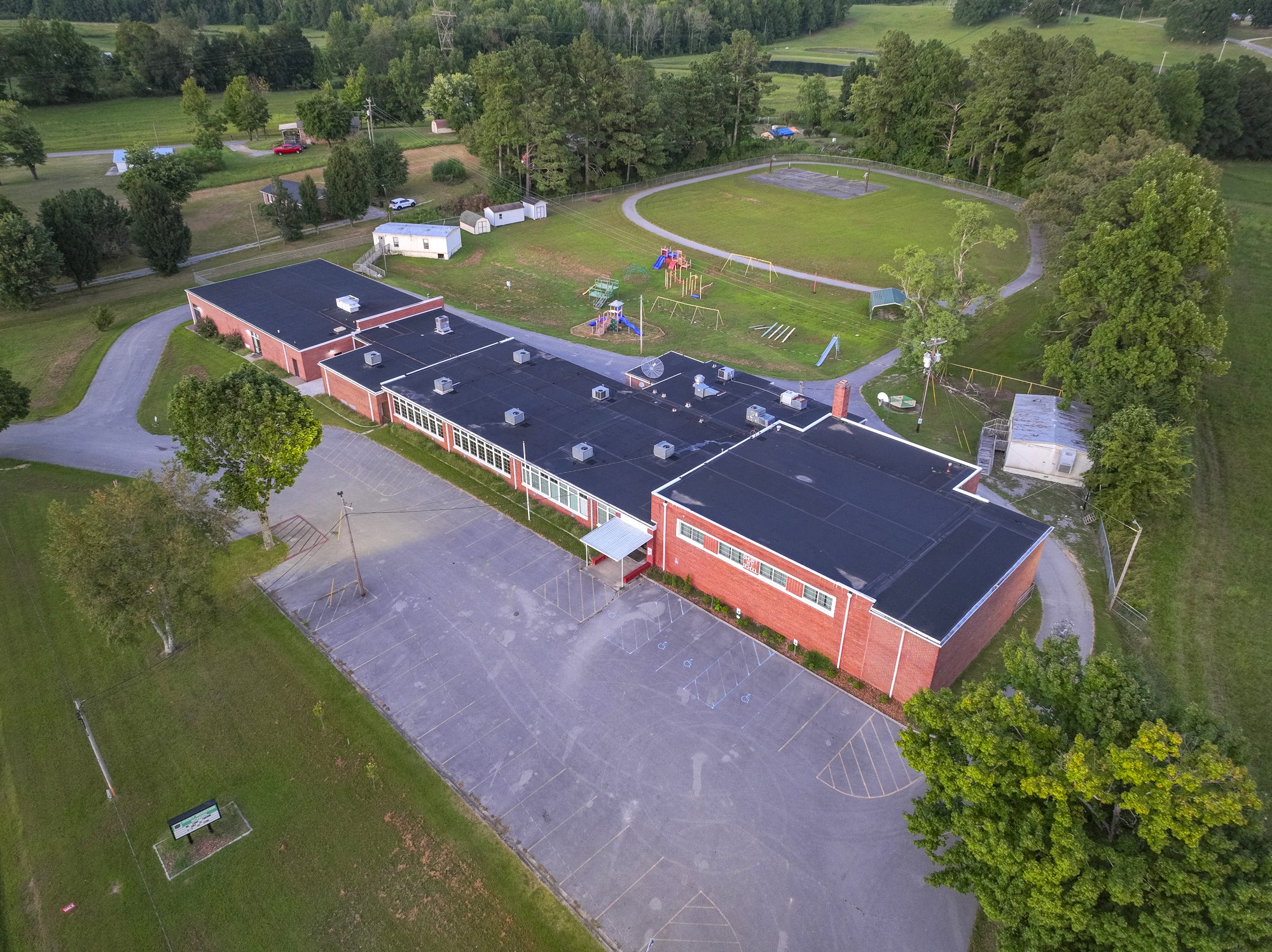 an aerial view of a house with a swimming pool