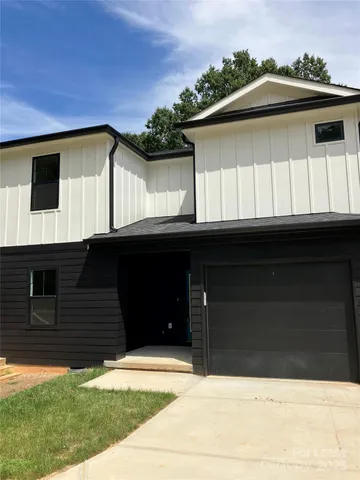 a black and white building with a outdoor space
