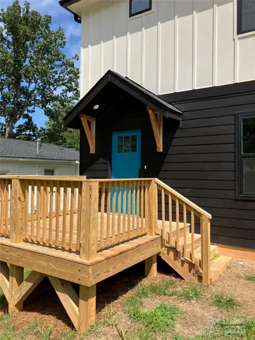 a view of wooden house with a window