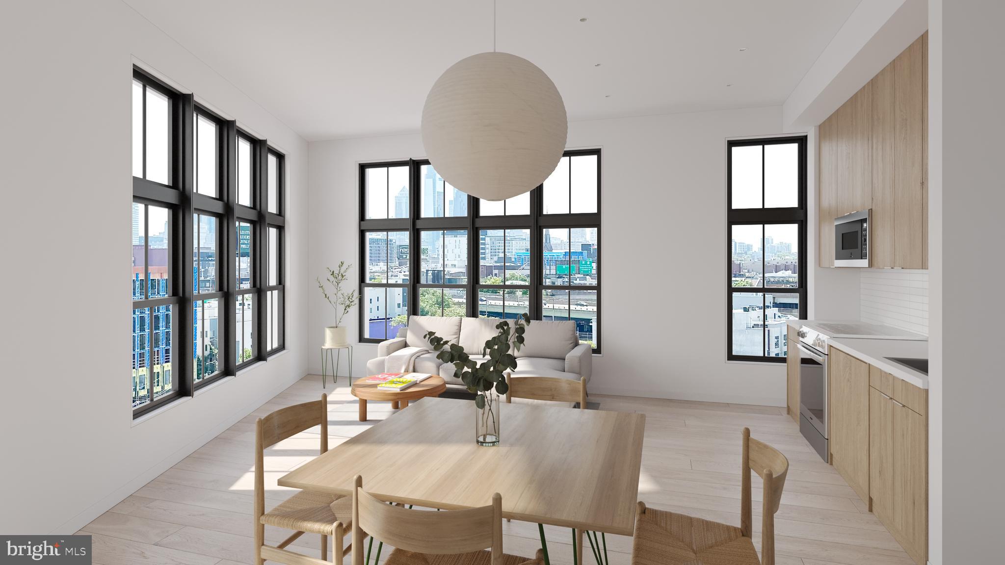 945 Frankford Avenue, Unit 208 Philadelphia, PA 19125 - Photo 13 of 20 a dining room with furniture a chandelier and wooden floor
