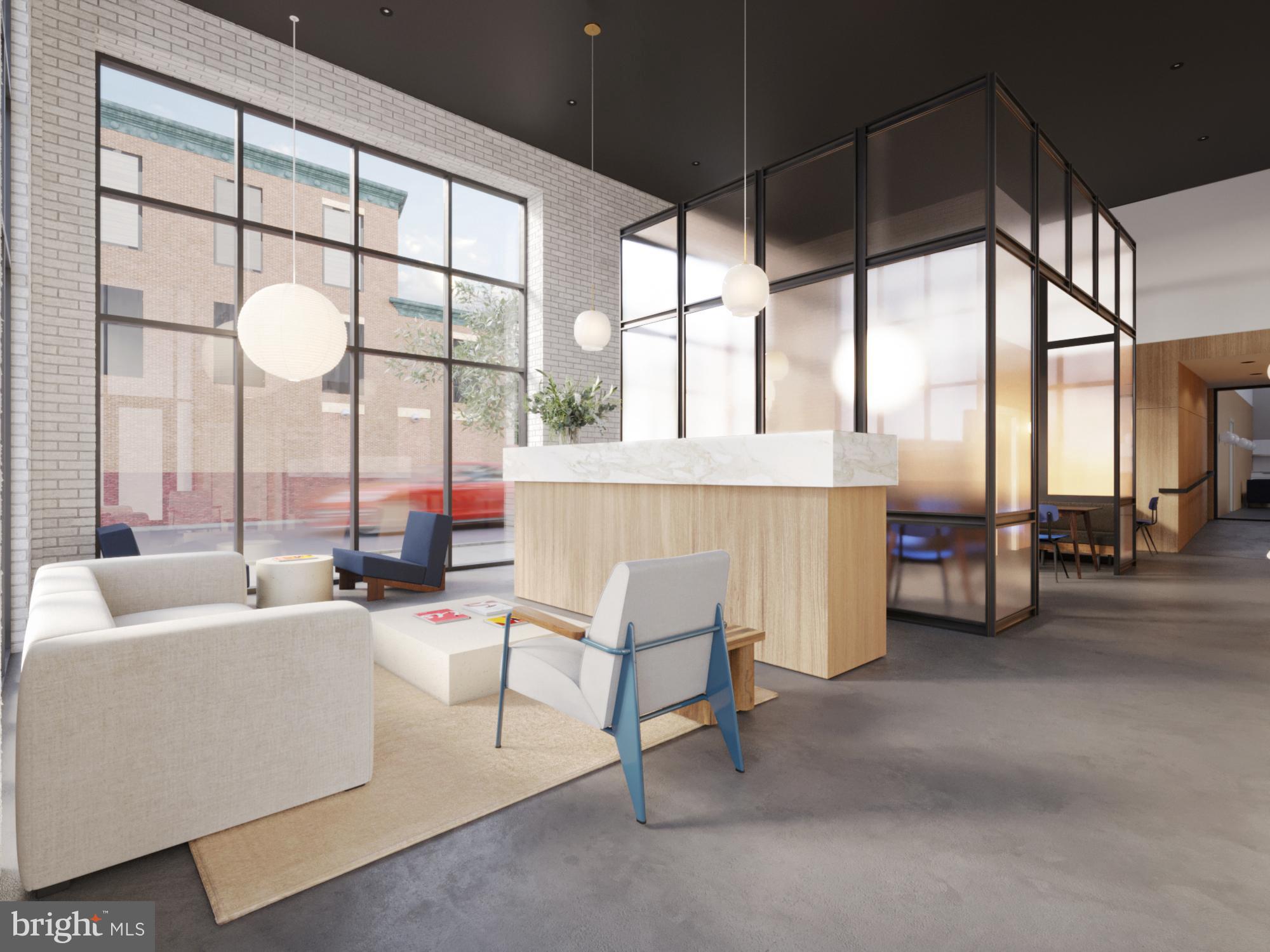 945 Frankford Avenue, Unit 208 Philadelphia, PA 19125 - Photo 3 of 20 a living room with furniture and a large window