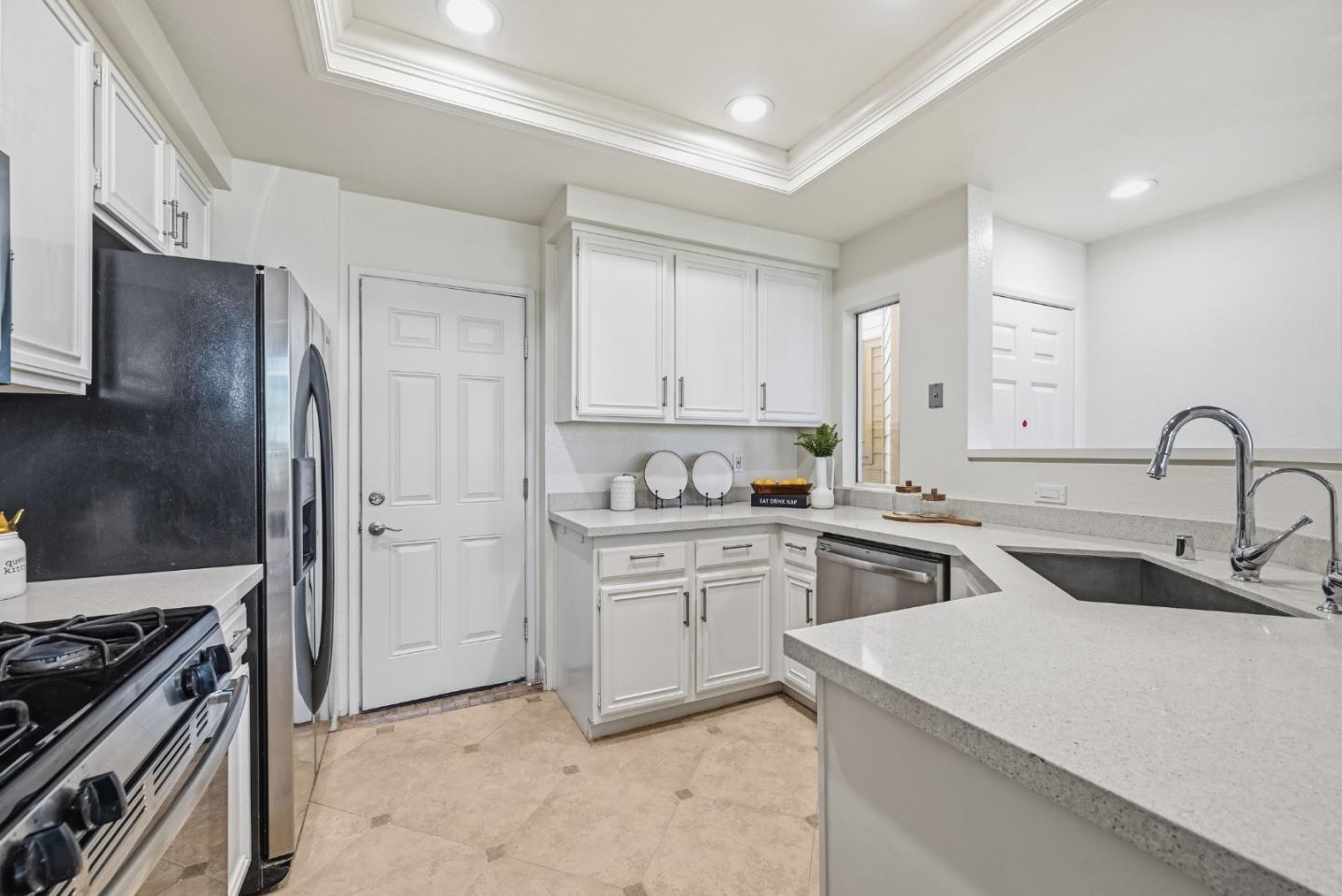 34590 Falls Terrace Fremont, CA 94555 - Photo 11 of 38 a kitchen with appliances a sink and cabinets