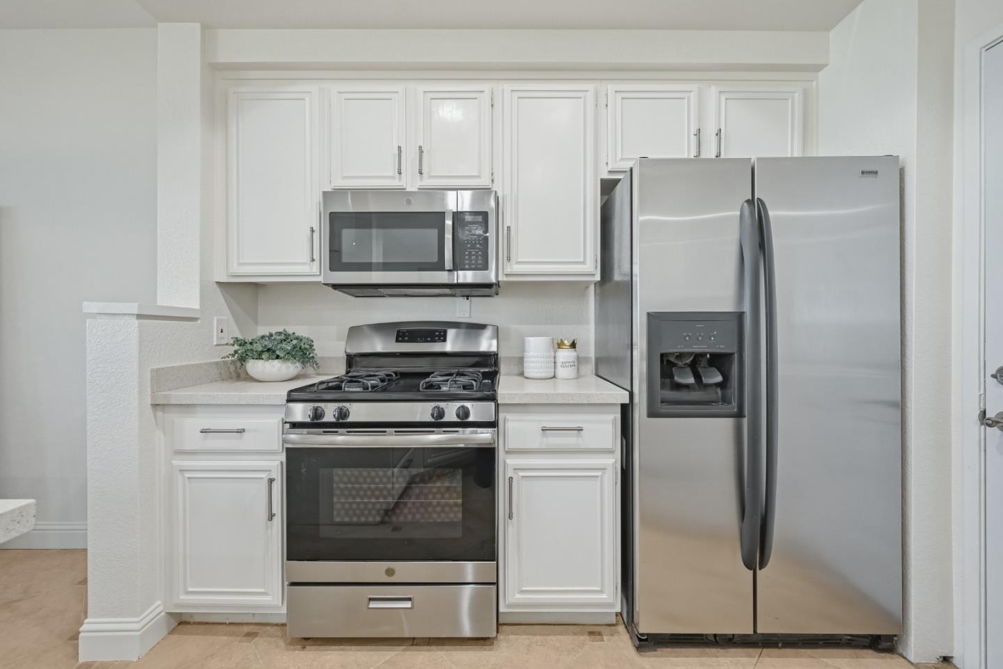 34590 Falls Terrace Fremont, CA 94555 - Photo 14 of 38 a kitchen with stainless steel appliances granite countertop a stove a refrigerator and a cabinets