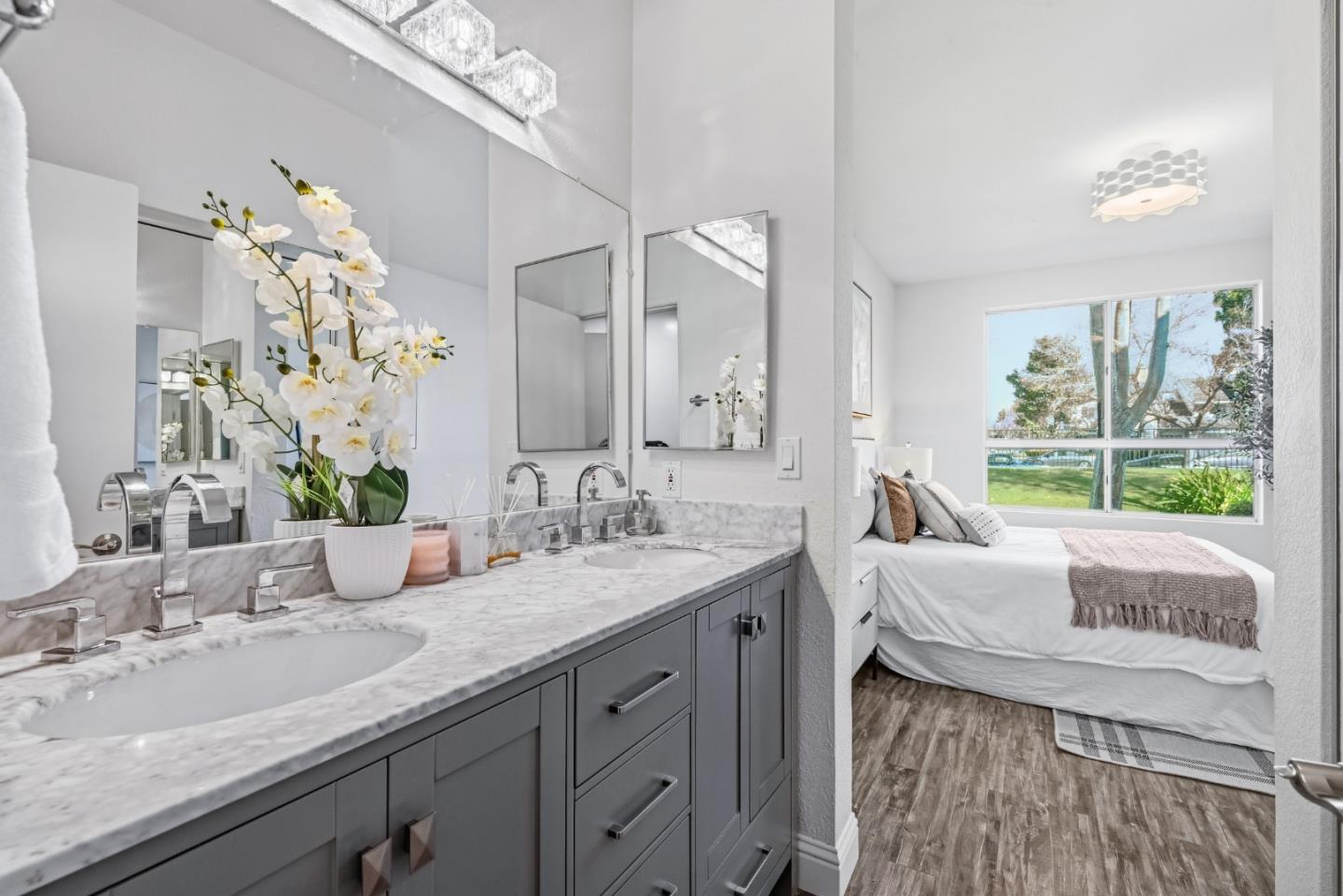 34590 Falls Terrace Fremont, CA 94555 - Photo 22 of 38 a bathroom with a granite countertop sink and a mirror