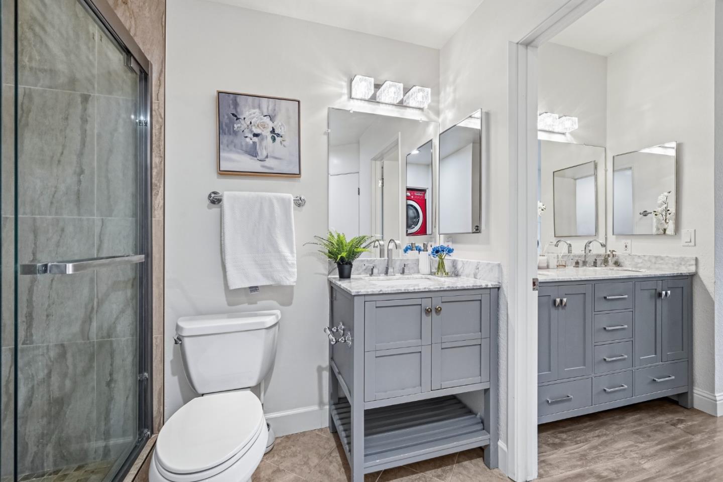 34590 Falls Terrace Fremont, CA 94555 - Photo 24 of 38 a bathroom with a toilet a sink a tub and mirror