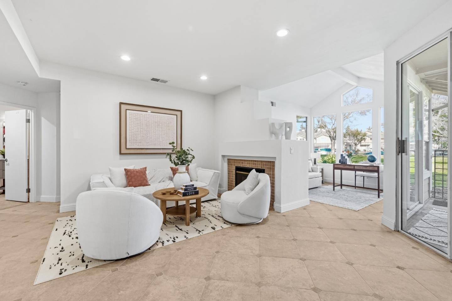 34590 Falls Terrace Fremont, CA 94555 - Photo 6 of 38 a living room with furniture a fireplace and a potted plant
