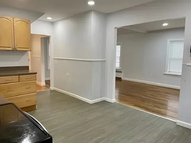 an empty room with wooden floor