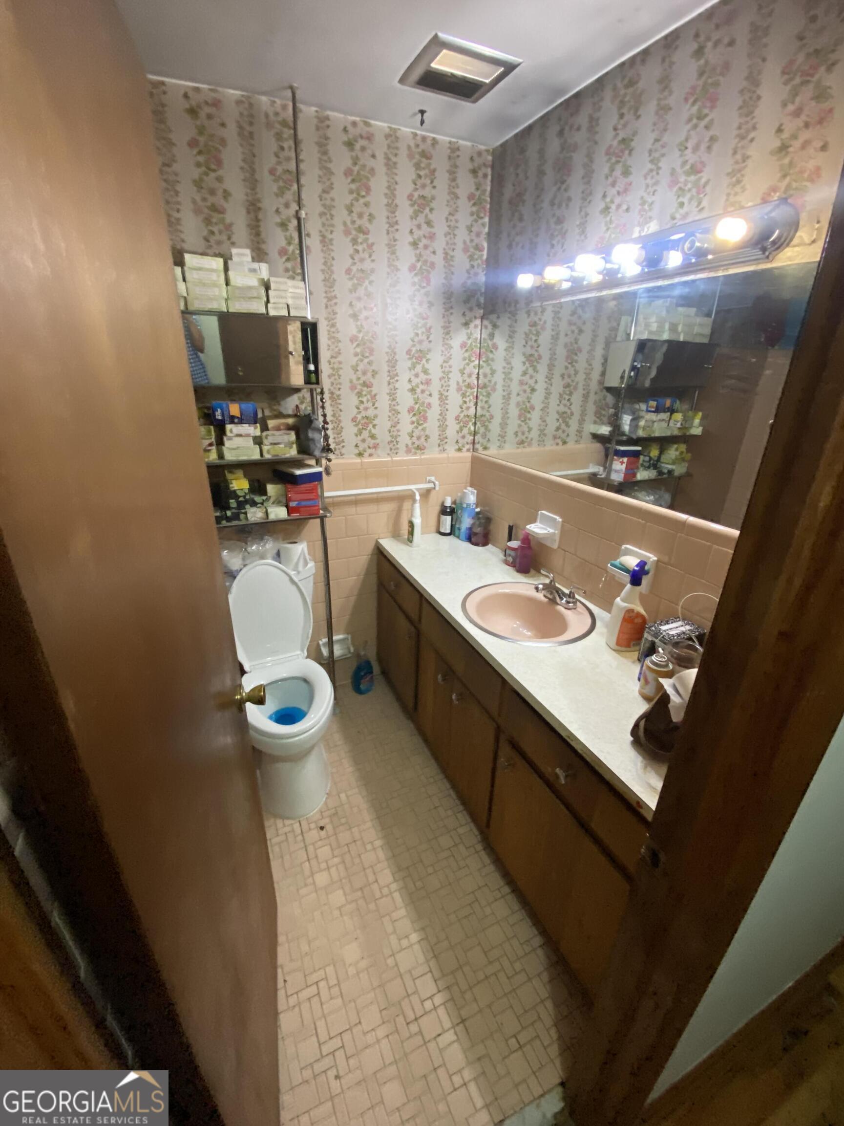 2464 Glenrock Drive Decatur, GA 30032 - Photo 7 of 7 a kitchen with a sink dishwasher stove and microwave with wooden floor