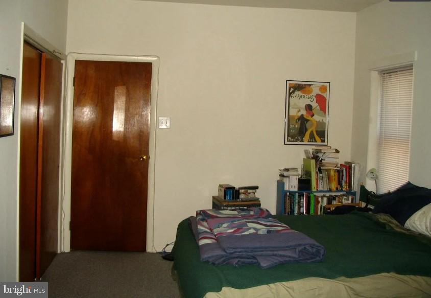 2003 Green Street, Unit 3R Philadelphia, PA 19130 - Photo 5 of 7 a spacious bedroom with a bed and a mirror
