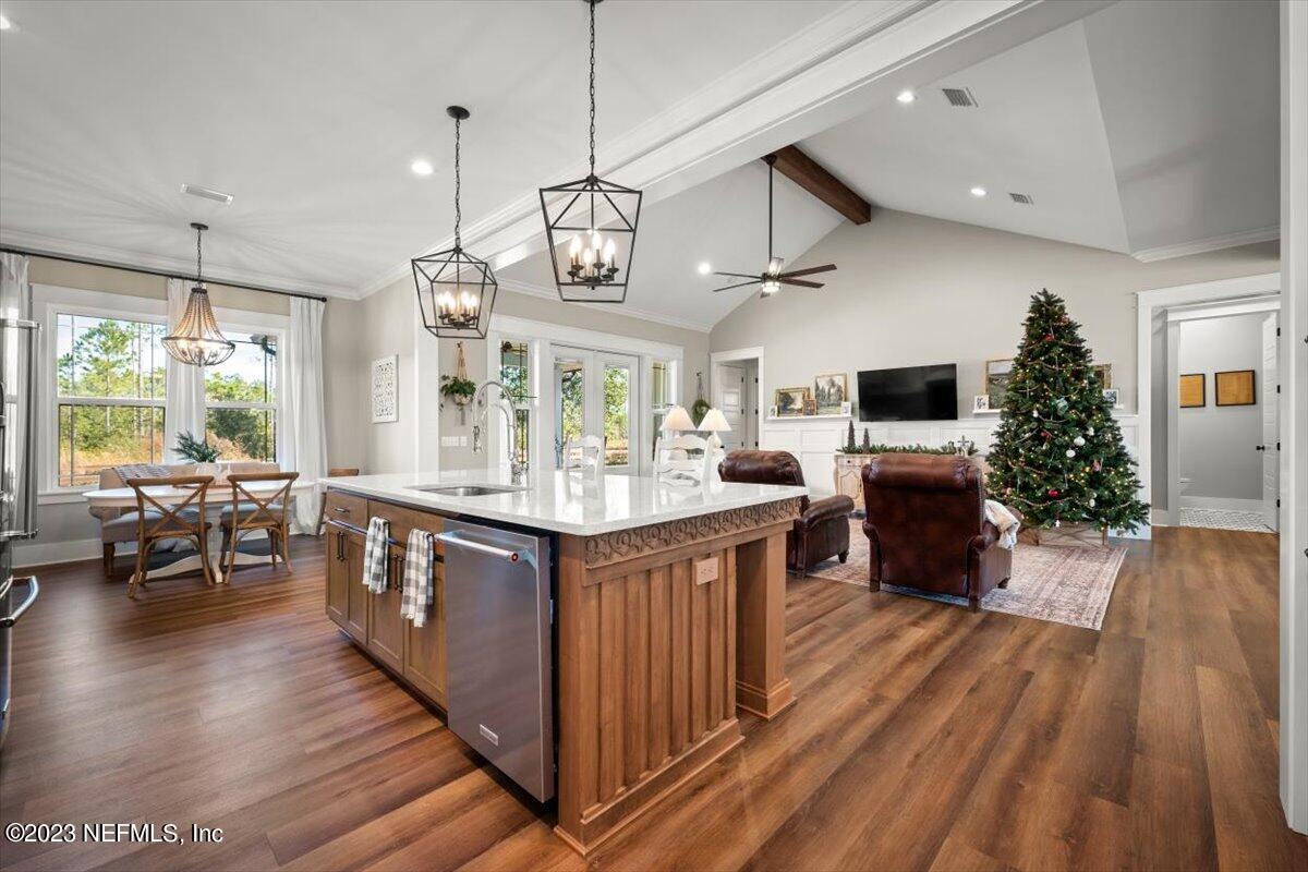 3200 Jane Lane Hilliard, FL 32046 - Photo 16 of 72 a kitchen with stainless steel appliances granite countertop a lot of counter space and wooden floors