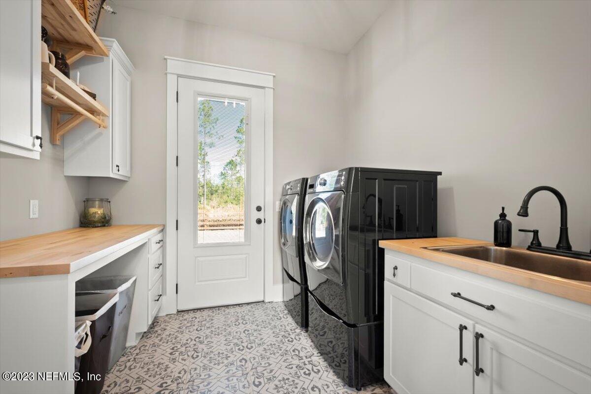3200 Jane Lane Hilliard, FL 32046 - Photo 22 of 72 a utility room with sink a washer and dryer