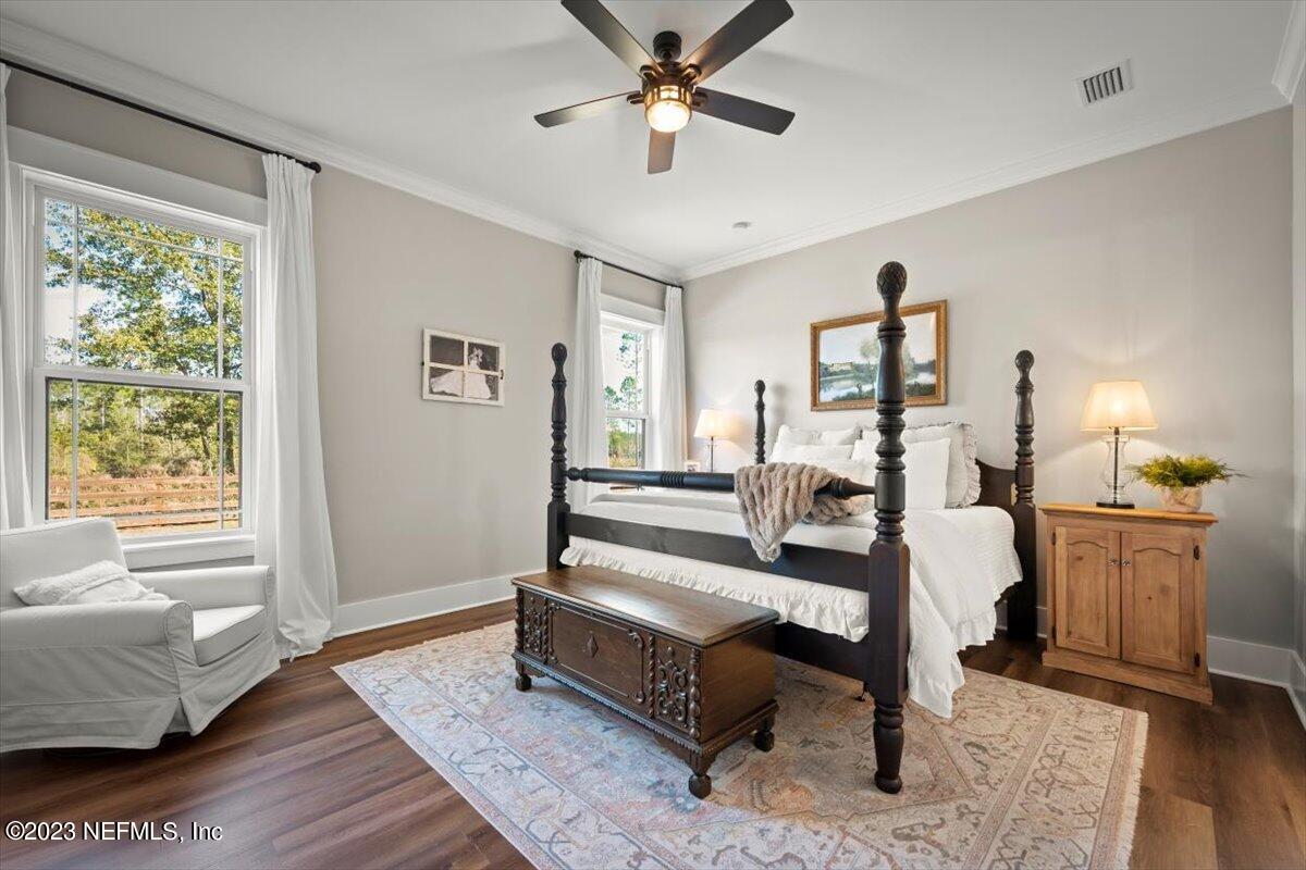 3200 Jane Lane Hilliard, FL 32046 - Photo 23 of 72 a bedroom with a bed and wooden floor