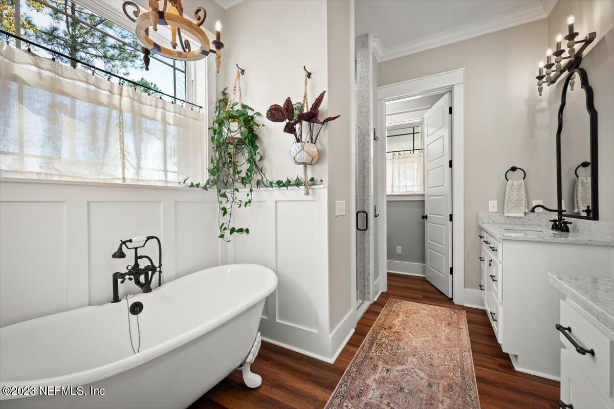 3200 Jane Lane Hilliard, FL 32046 - Photo 26 of 72 a bathroom with a tub sink and mirror