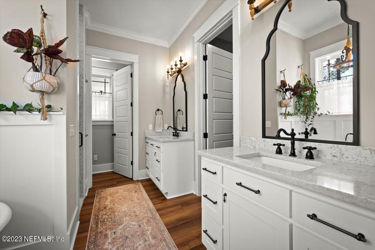 3200 Jane Lane Hilliard, FL 32046 - Photo 27 of 72 a spacious bathroom with a granite countertop sink and a mirror