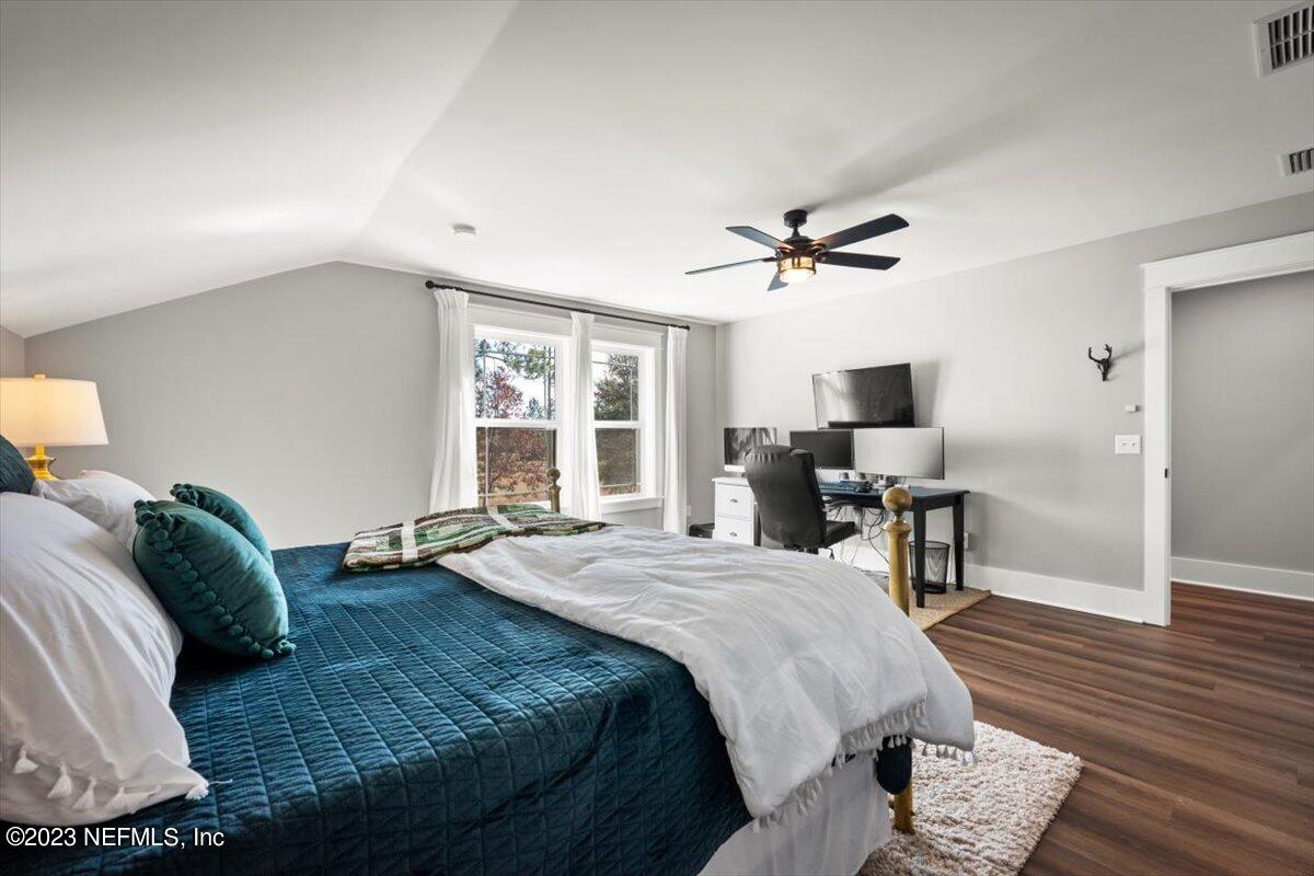 3200 Jane Lane Hilliard, FL 32046 - Photo 30 of 72 a bed room with a bed and a chair